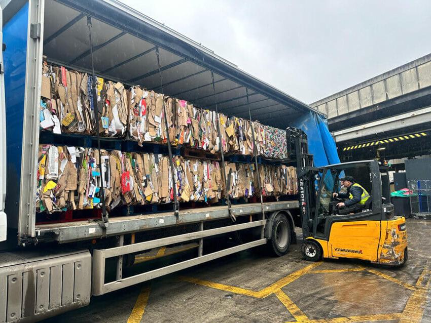 A lorry being filled with cardboard waste at Euston rail station